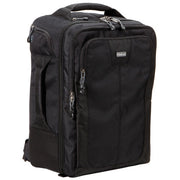 Think Tank Airport Commuter camera backpack — black carry-on bag with padded camera compartment, laptop sleeve, and side tripod straps.