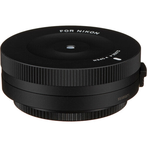 Sigma USB Dock for Nikon F-mount lenses enabling firmware updates, autofocus calibration, and customization of focus speed, focus limiters, and optical stabilization via Sigma Optimization Pro software.