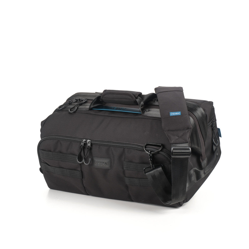 Black duffel bag with a strap on a white background