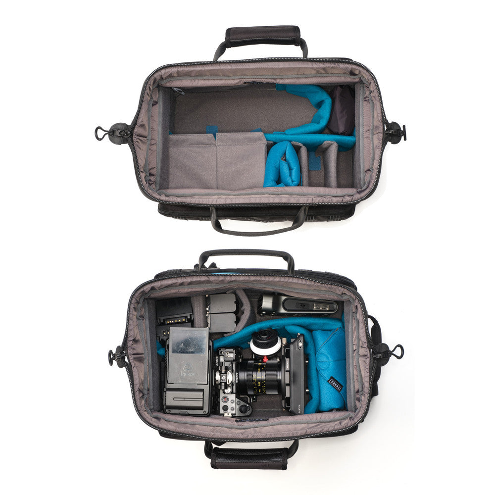Camera bag with compartments containing camera equipment on a white background
