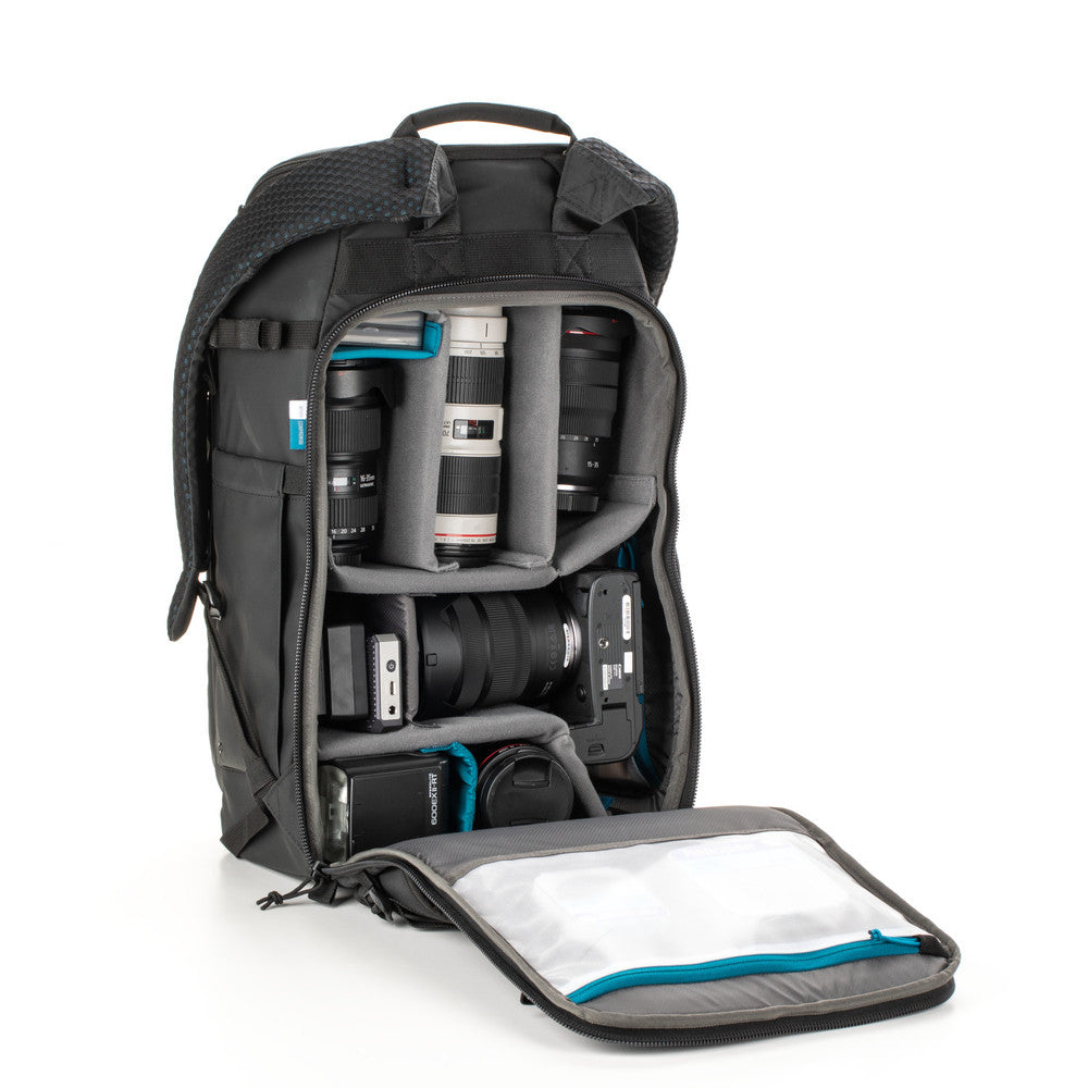Camera backpack with compartments for camera equipment on a white background
