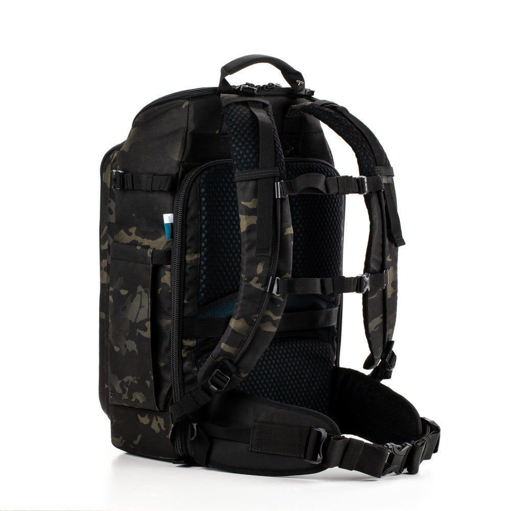 Black and camouflage-patterned backpack on a white background