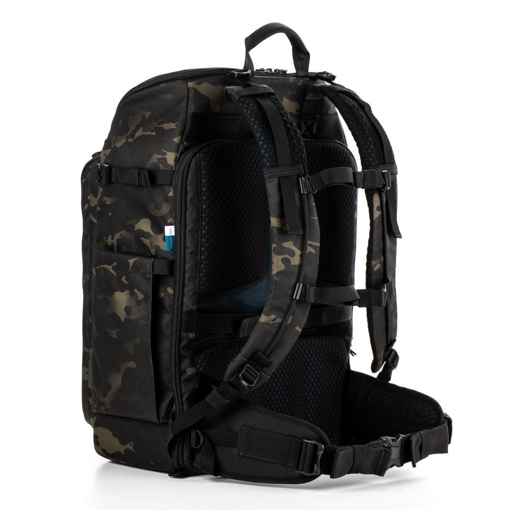 Camouflage backpack with black straps on a white background
