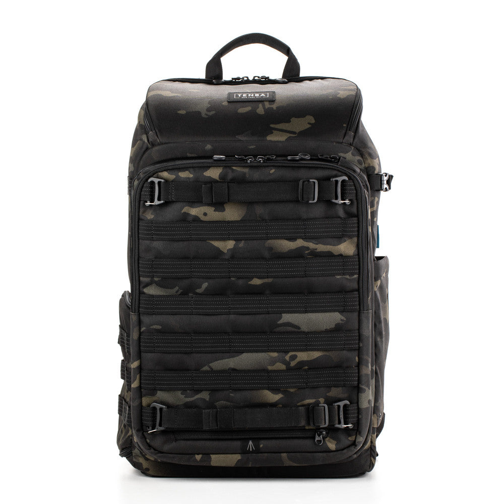 Camouflage backpack with multiple zippers on a white background