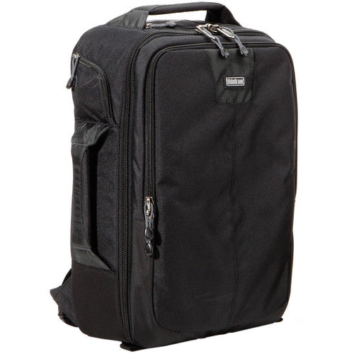 Think Tank Airport Essentials camera backpack — compact carry-on size black pack with front organizer pocket, grab handles, and laptop sleeve