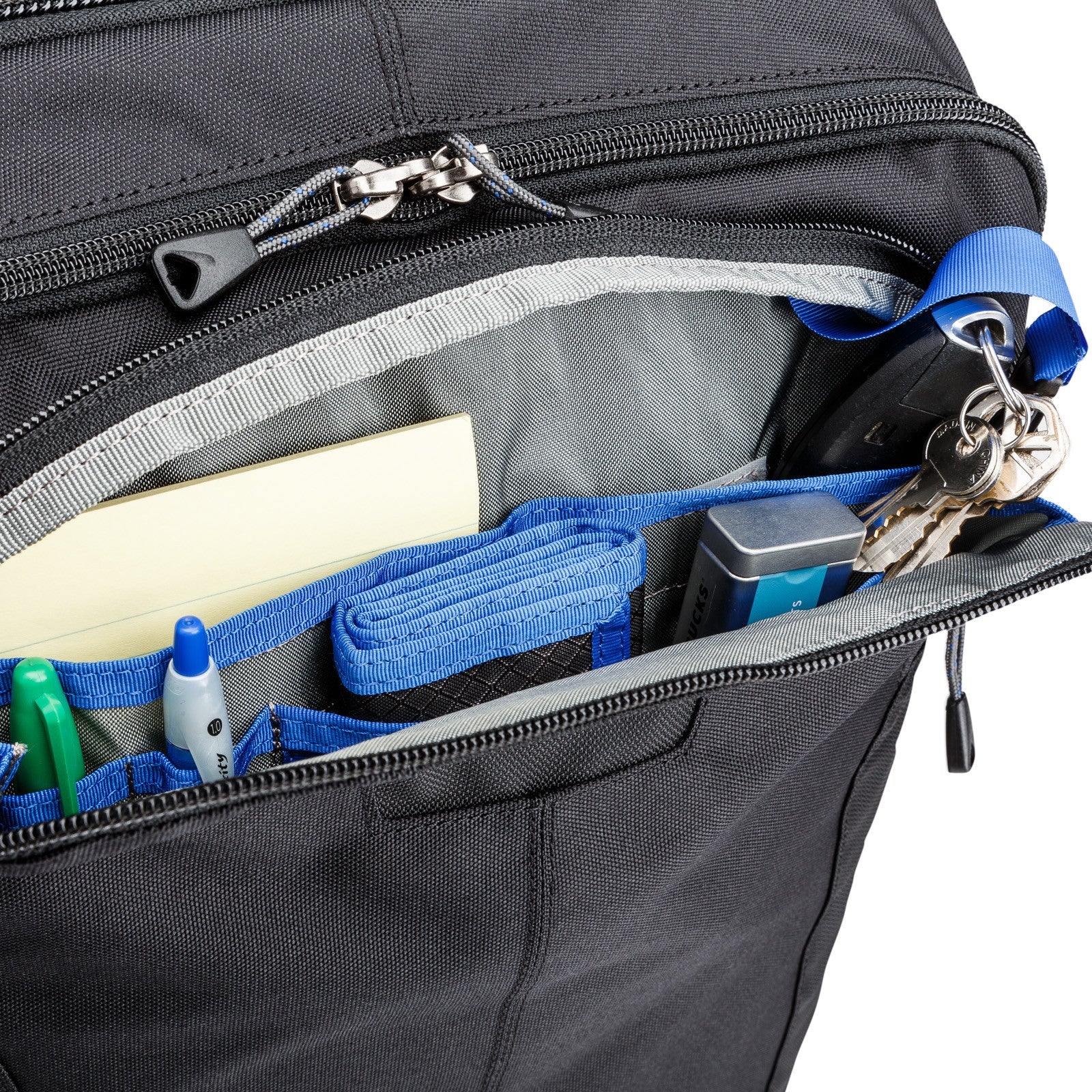 Think Tank Airport Commuter camera backpack — black carry-on bag with padded camera compartment, laptop sleeve, and side tripod straps.