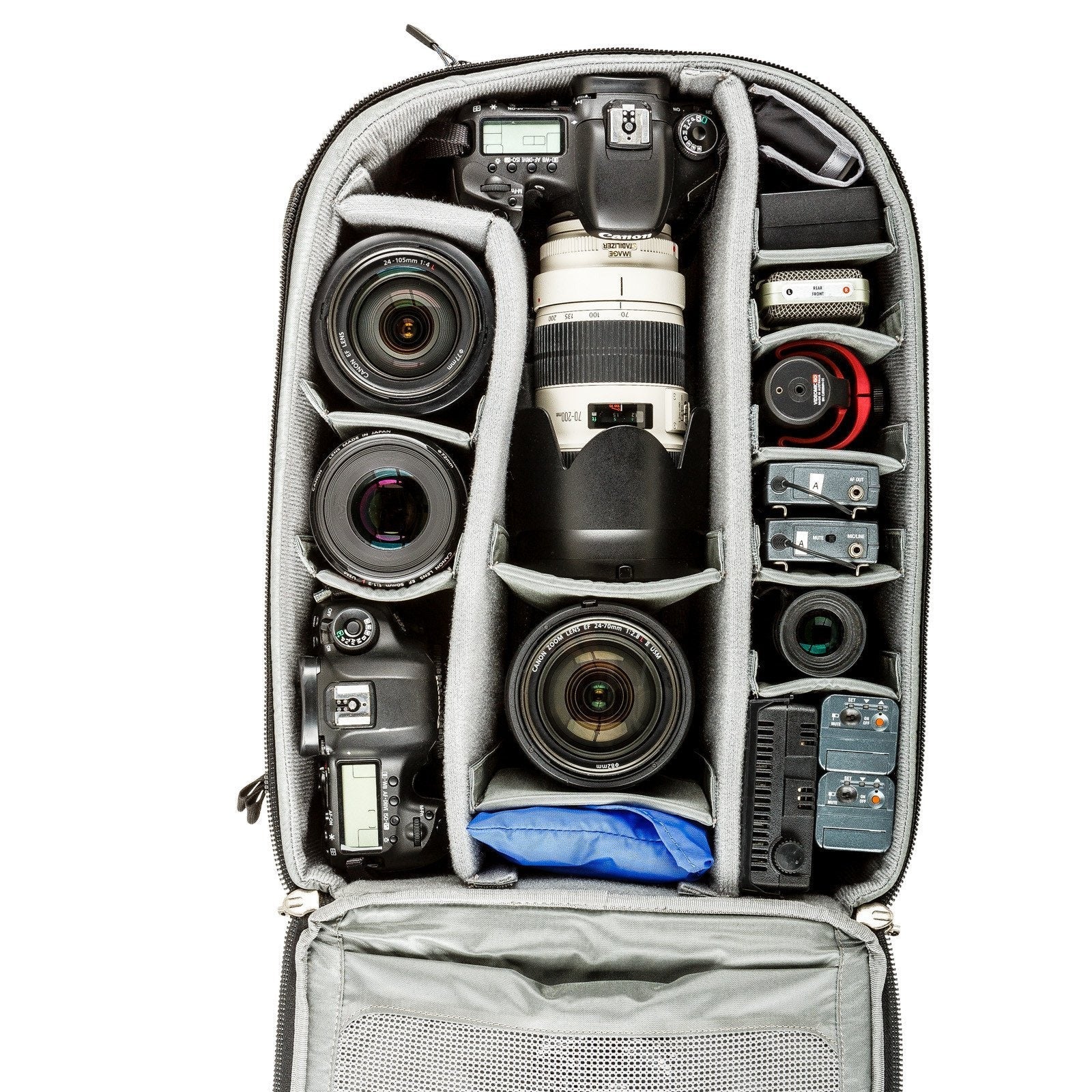 Think Tank Airport Commuter camera backpack — black carry-on bag with padded camera compartment, laptop sleeve, and side tripod straps.