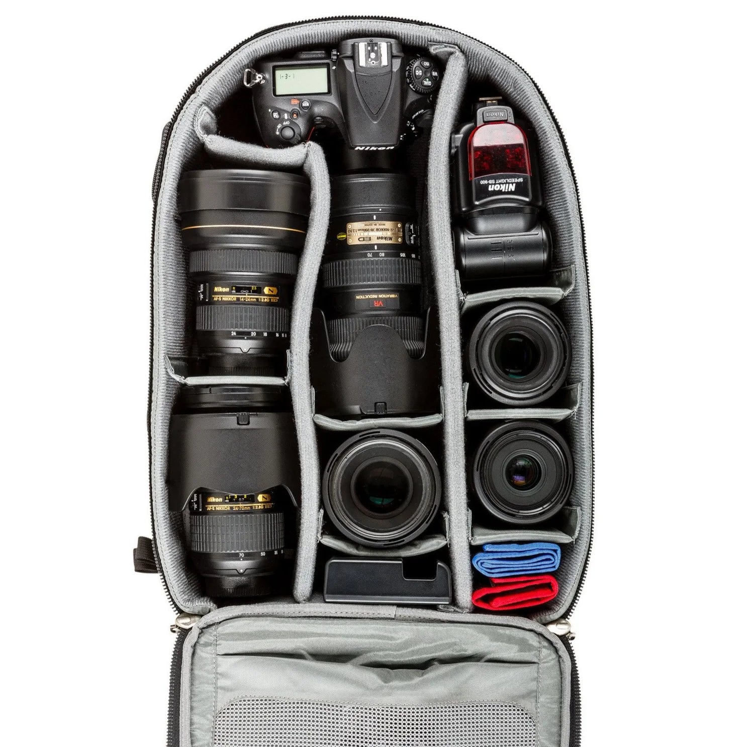 Think Tank Airport Essentials camera backpack — compact carry-on size black pack with front organizer pocket, grab handles, and laptop sleeve