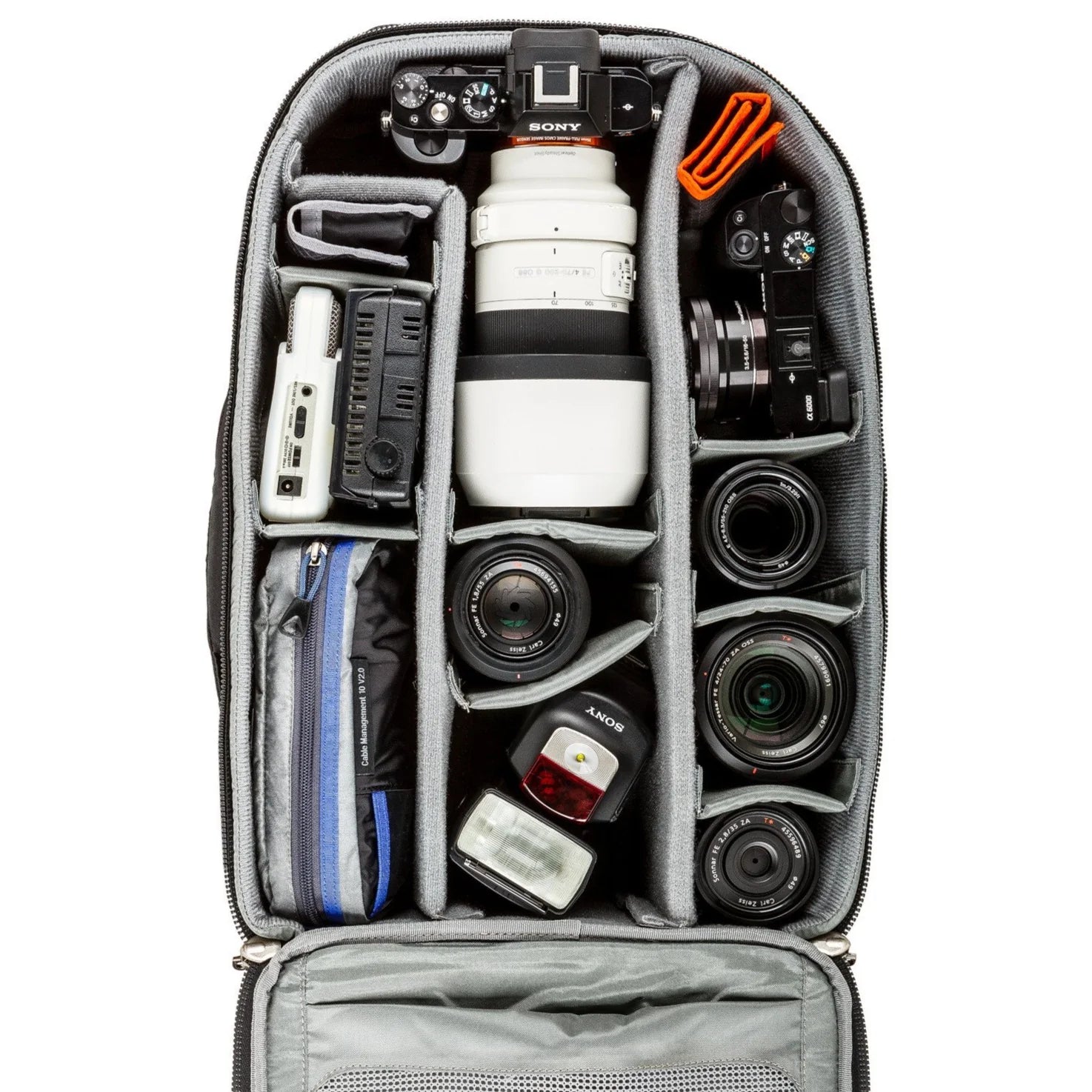 Think Tank Airport Essentials camera backpack — compact carry-on size black pack with front organizer pocket, grab handles, and laptop sleeve