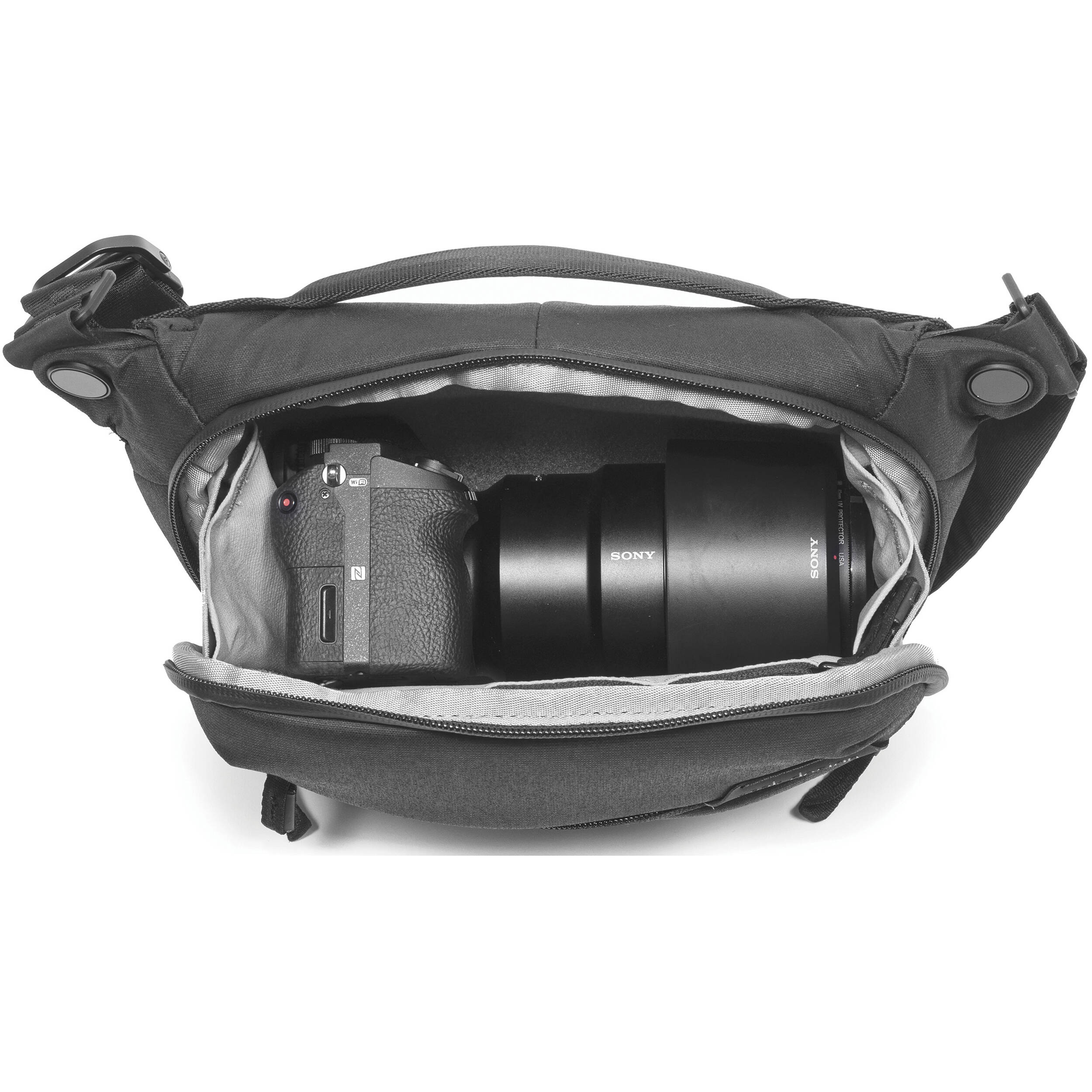 Everyday Sling V2.0 3L ash bag worn as waist or shoulder sling with zippered compartments.