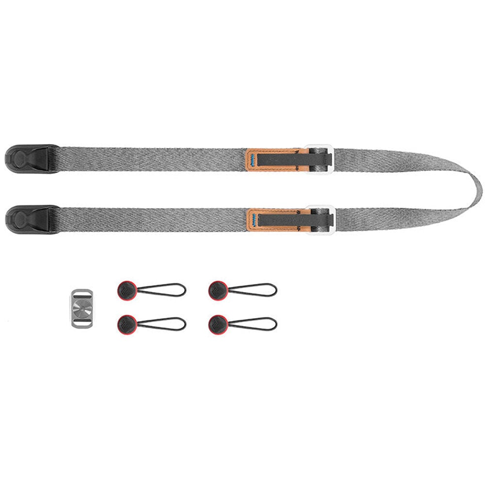 Peak Design Leash camera strap in Ash color, adjustable length from 83 to 145 cm, slim nylon webbing with leather accents, quick-adjust aluminum sliders, quick-release anchors rated for 90 kg, versatile for neck, shoulder, or cross-body carry.
