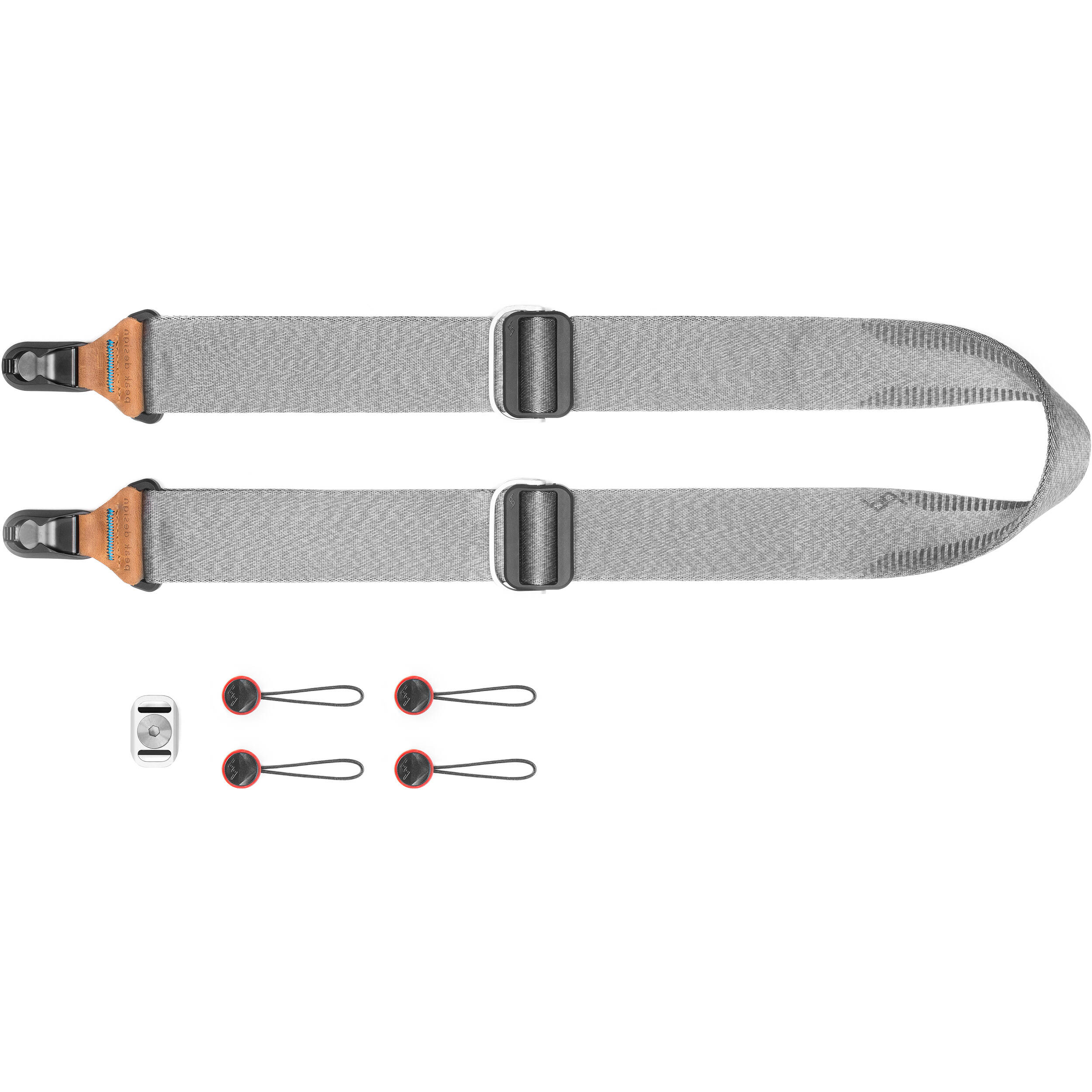 Peak Design Slide camera strap in Ash color, adjustable length 99-145 cm, 4.6 cm wide padded nylon webbing with smooth and grippy reversible sides, quick-connect Anchor Link system, supports up to 90 kg, usable as sling, neck, or shoulder strap.