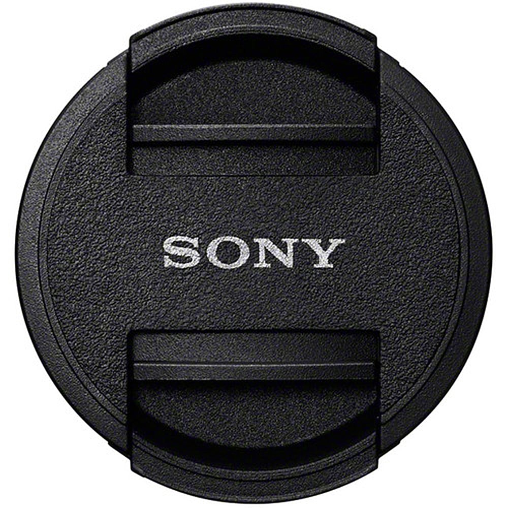Black Sony lens cap on a white background