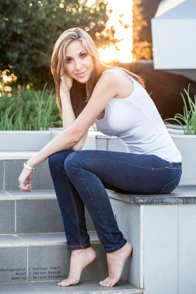 Photo of a model in a white t-shirt and blue jeans