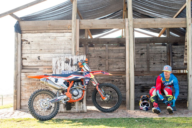 A photograph of a KTM rider getting ready to ride