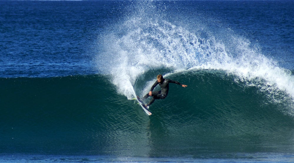 Photograph of a surfer ripping it