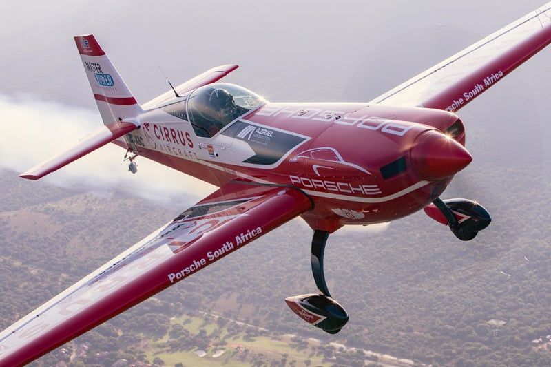Air-to-air photograph of a red aircraft