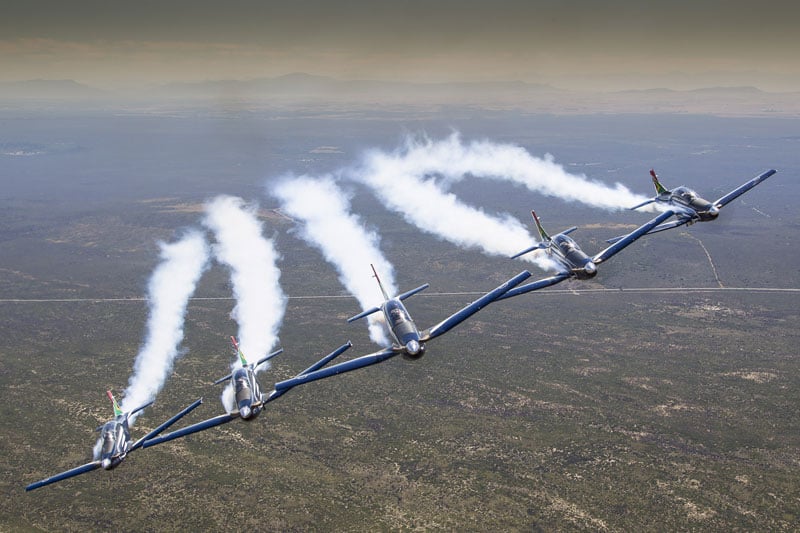 Photograph of 5 Silver Falcons flying next to one another