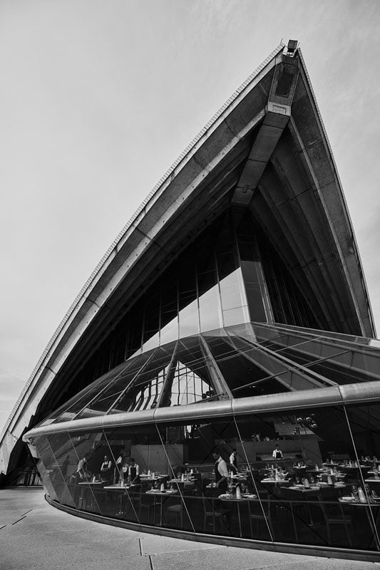 Black and white image of Sydney opera house and waiters