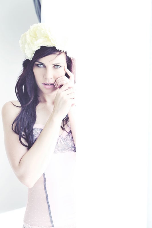 boudoir-model-by-window-light woman with flower crown high key boudoir photograph