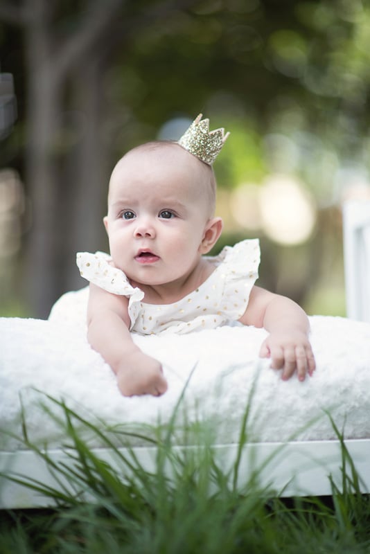 Toddler Photography: Little baby girl with a gold crown on her head