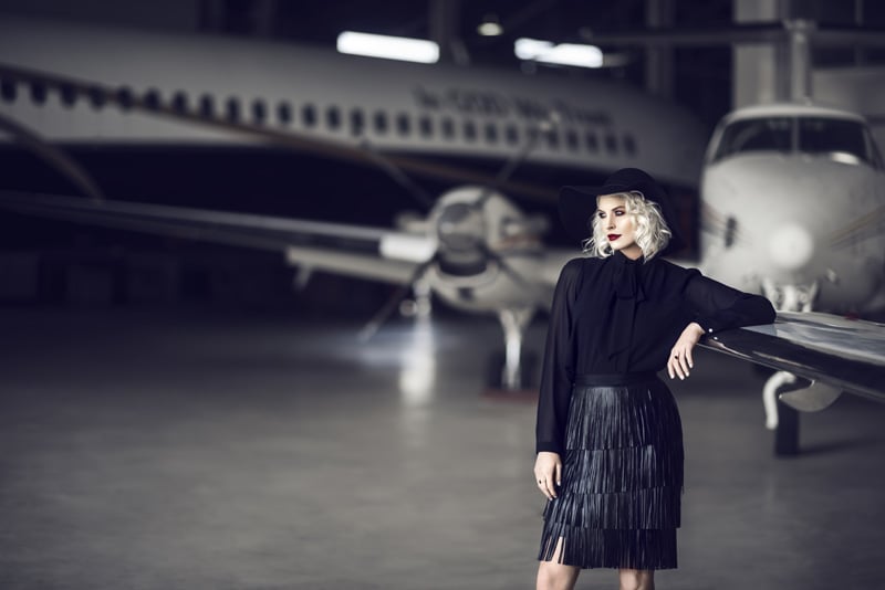 Glamorous photograph of a model in an aircraft hanger