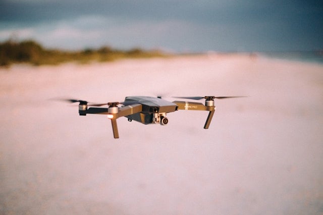 Mavic Pro drone flying over a beach