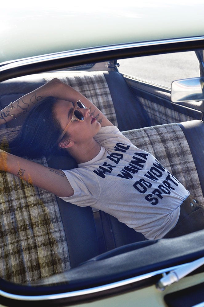 Film photograph of a model in a car taken by Jessica Levin
