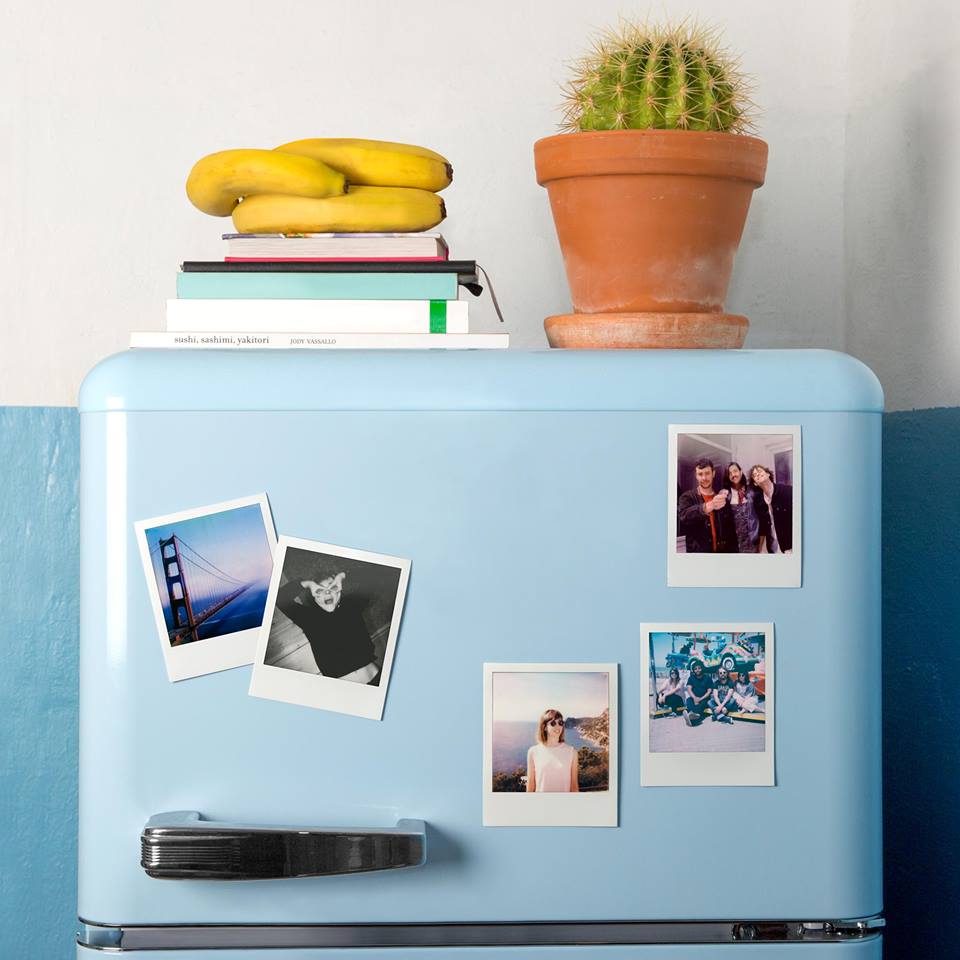 Polaroid images on a fridge Polaroid images on a fridge