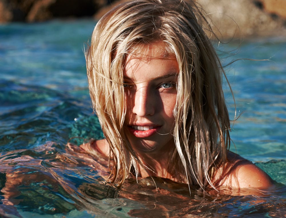 Close-up portrait of a model in the ocean photographed by Sherwin Liang