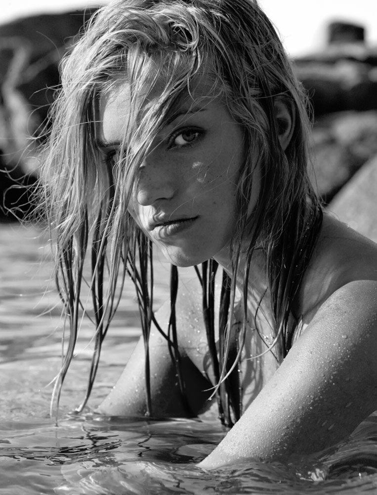 Black and white portrait of a model in the ocean photographed by Sherwin Liang