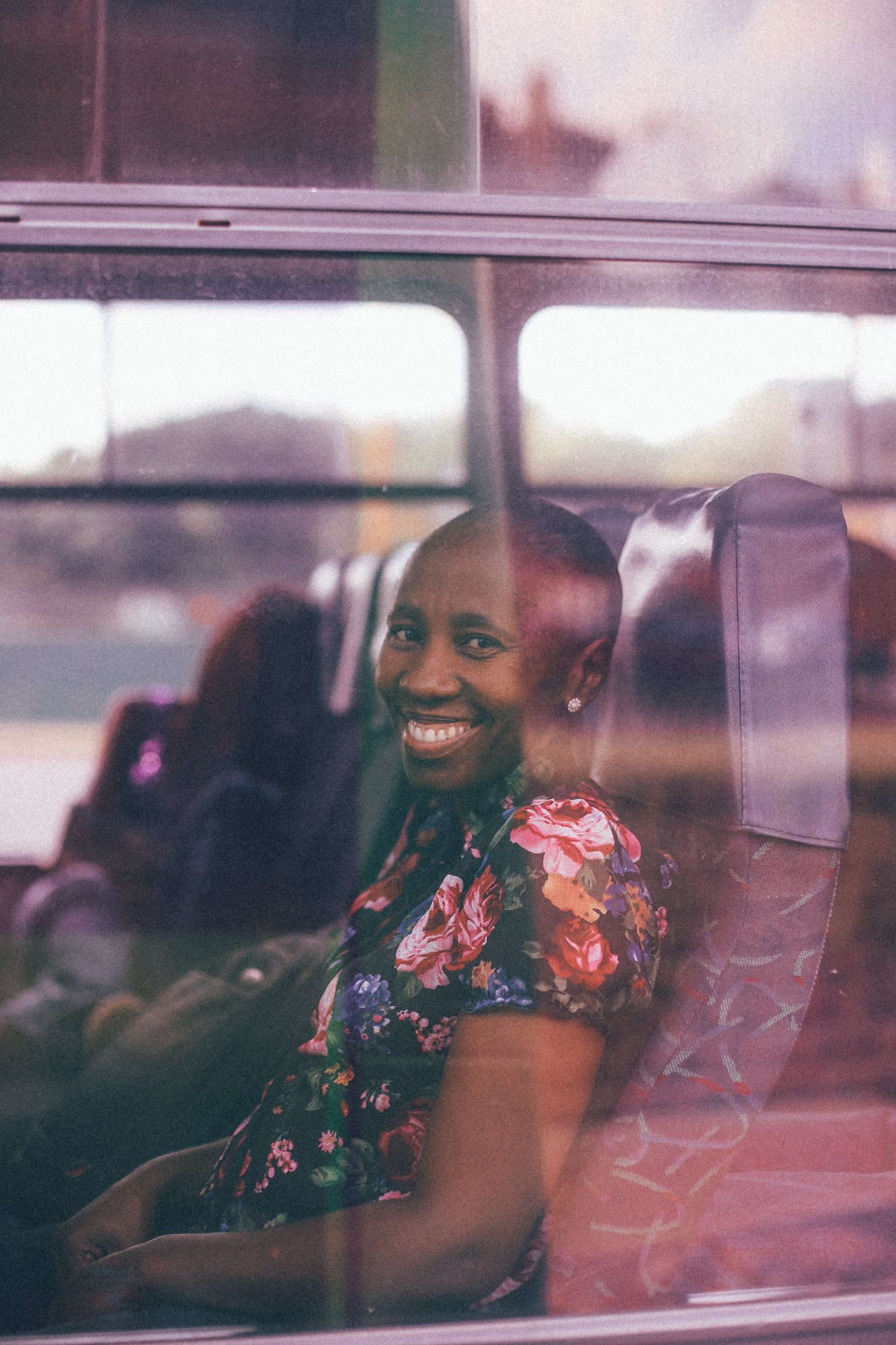 A candid moment whilst a women rides the bus on the way home. Photograph by Nicholas Rawhani.