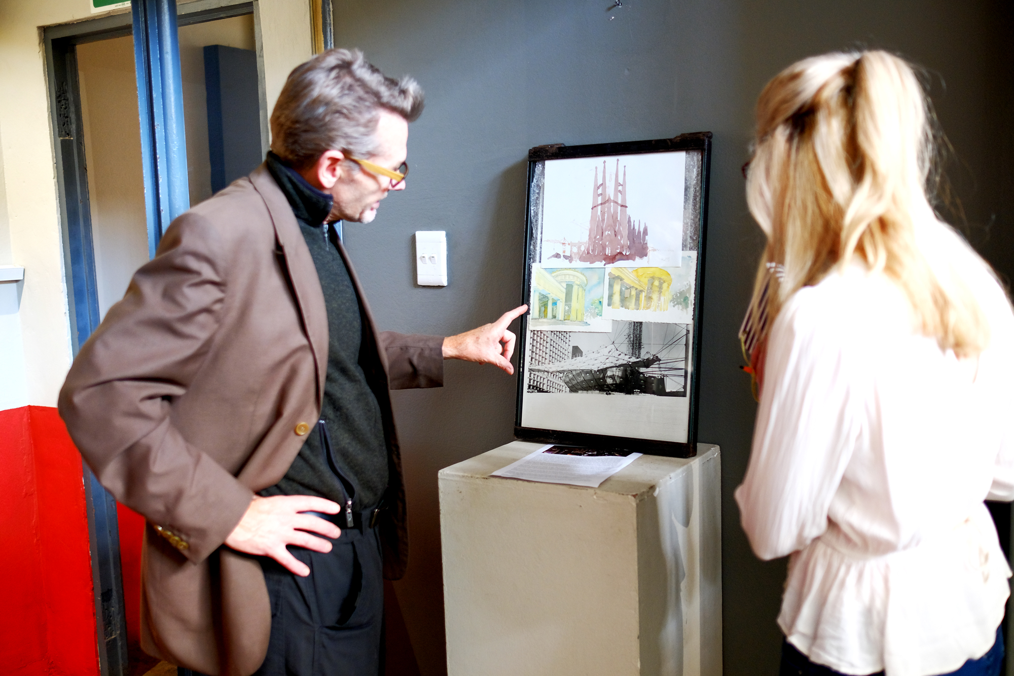 Leon-Krige-interview-with-Anna-Lourens-ODP-2 Leon Krige points at one of his aquarelles of a Gothic Cathedral.