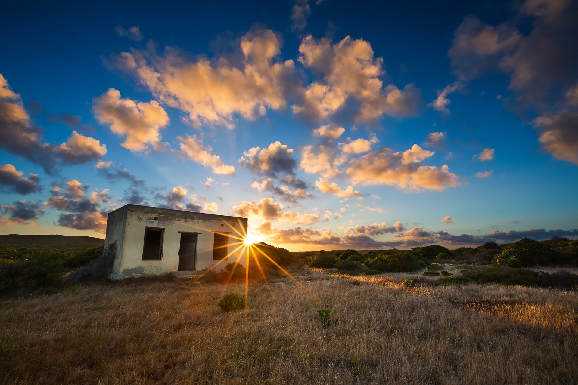 Taken in Arniston. A little forgotten house with magical clouds at sunset