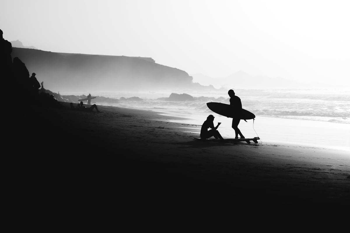 Surfs up Surfers on the beach