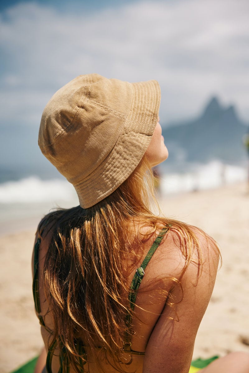 Summer days Woman on the beach soaking up the sun