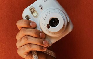 We're unpacking why an instant camera is a must-have this season.