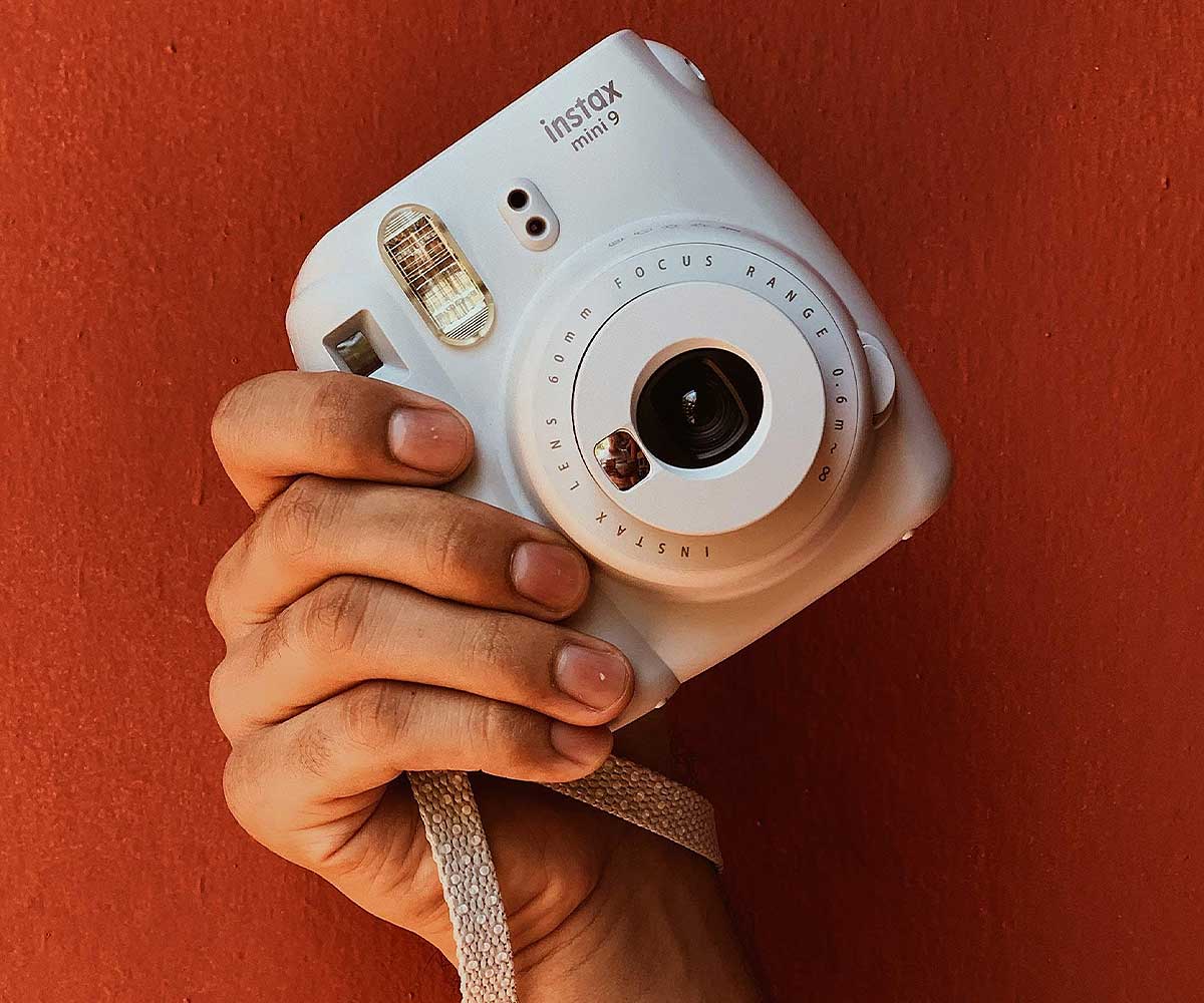 We're unpacking why an instant camera is a must-have this season.