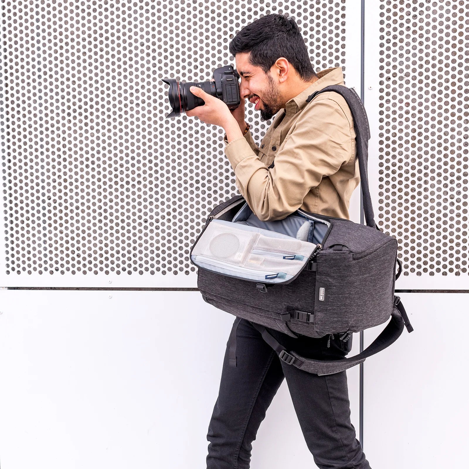 Think Tank Urban Access 13 backpack — stylish black daypack with side-access camera section and padded laptop compartment.