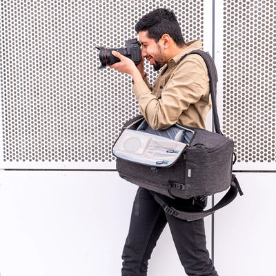 Think Tank Urban Access 13 backpack — stylish black daypack with side-access camera section and padded laptop compartment.