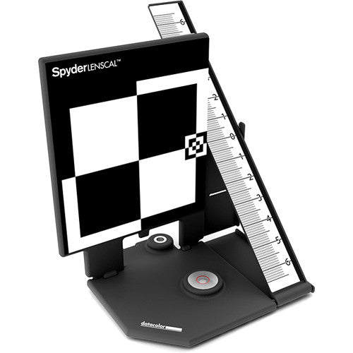 Spyder LENSCAL color calibration device with checkered pattern and ruler on a white background