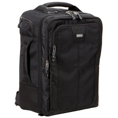 Think Tank Airport Commuter camera backpack — black carry-on bag with padded camera compartment, laptop sleeve, and side tripod straps.