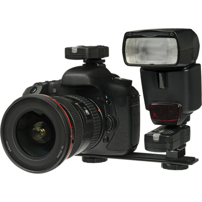 DSLR camera with lens and flash on a white background