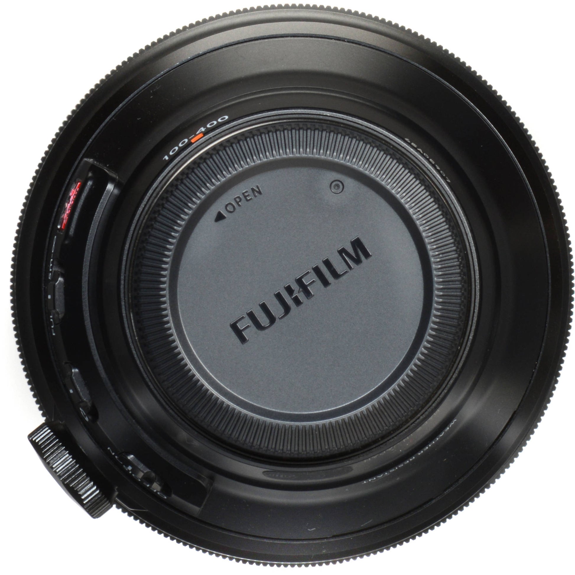 Top view of a Fujifilm camera lens on a white background