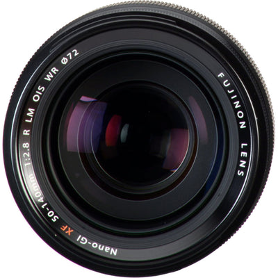 Close-up of a Fujifilm camera lens on a white background