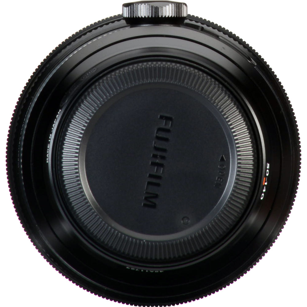Close-up of a Fujifilm camera lens on a white background