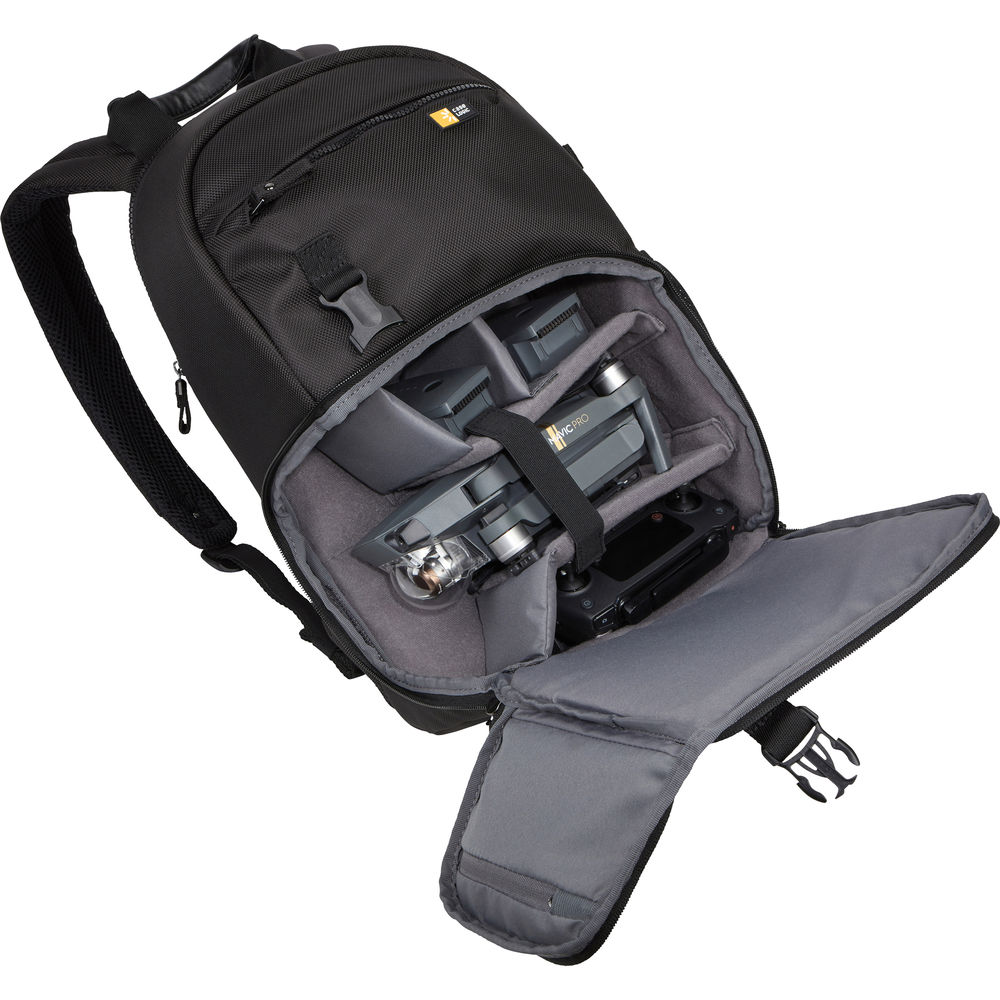 Black and gray backpack with camera equipment on a white background