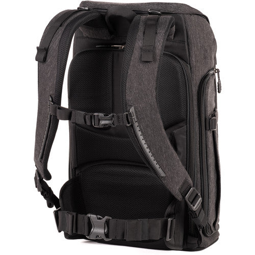 Think Tank Urban Access 15 camera backpack — black pack with side-loading panels, rear entry flap, and front tripod strap.