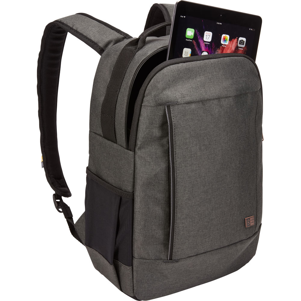 Gray backpack with a tablet in the front pocket on a white background
