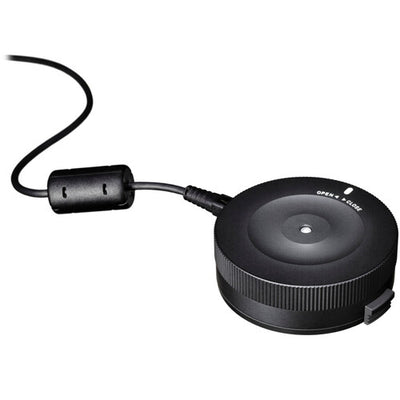 Sigma USB Dock for Nikon F-mount lenses enabling firmware updates, autofocus calibration, and customization of focus speed, focus limiters, and optical stabilization via Sigma Optimization Pro software.
